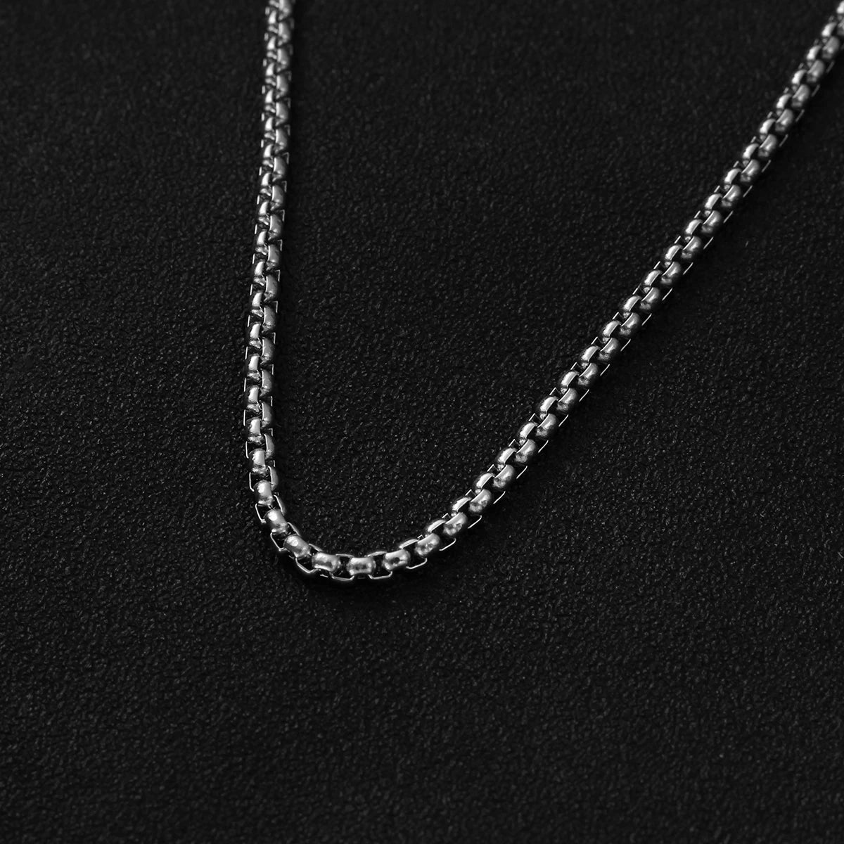 NOIR CROSS PENDANT NECKLACE